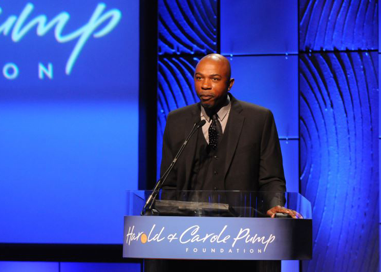 Greg Anthony at the podium during dinner